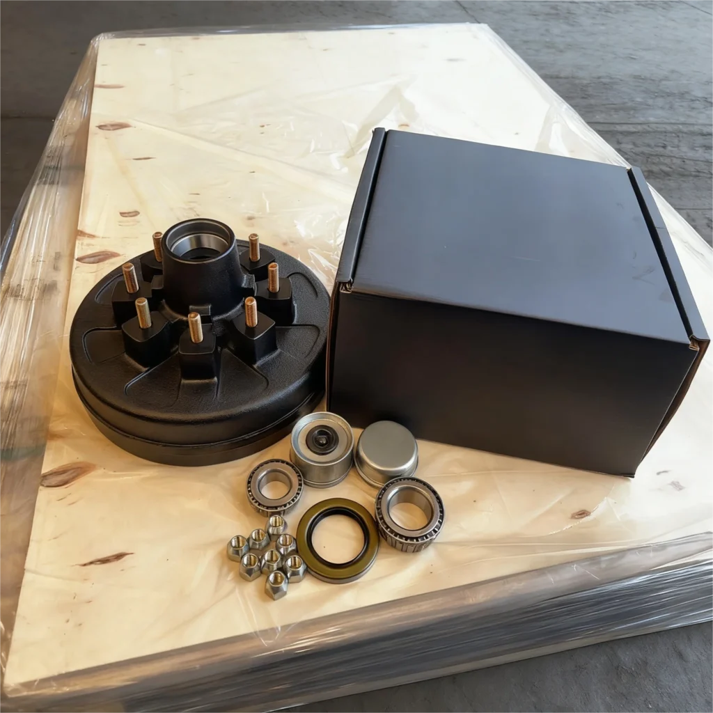 The brake drums are packaged in cardboard boxes from a Chinese supplier.